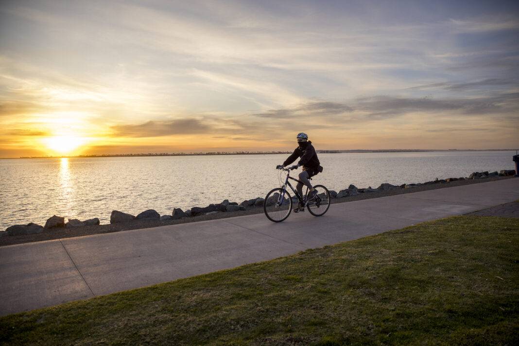 A bicycle rider at San Diego salt flats.